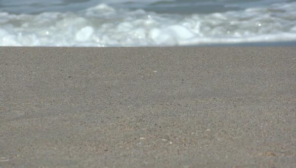 Beach Waves on Sand