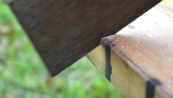 Worker Sawing Wood 2×4